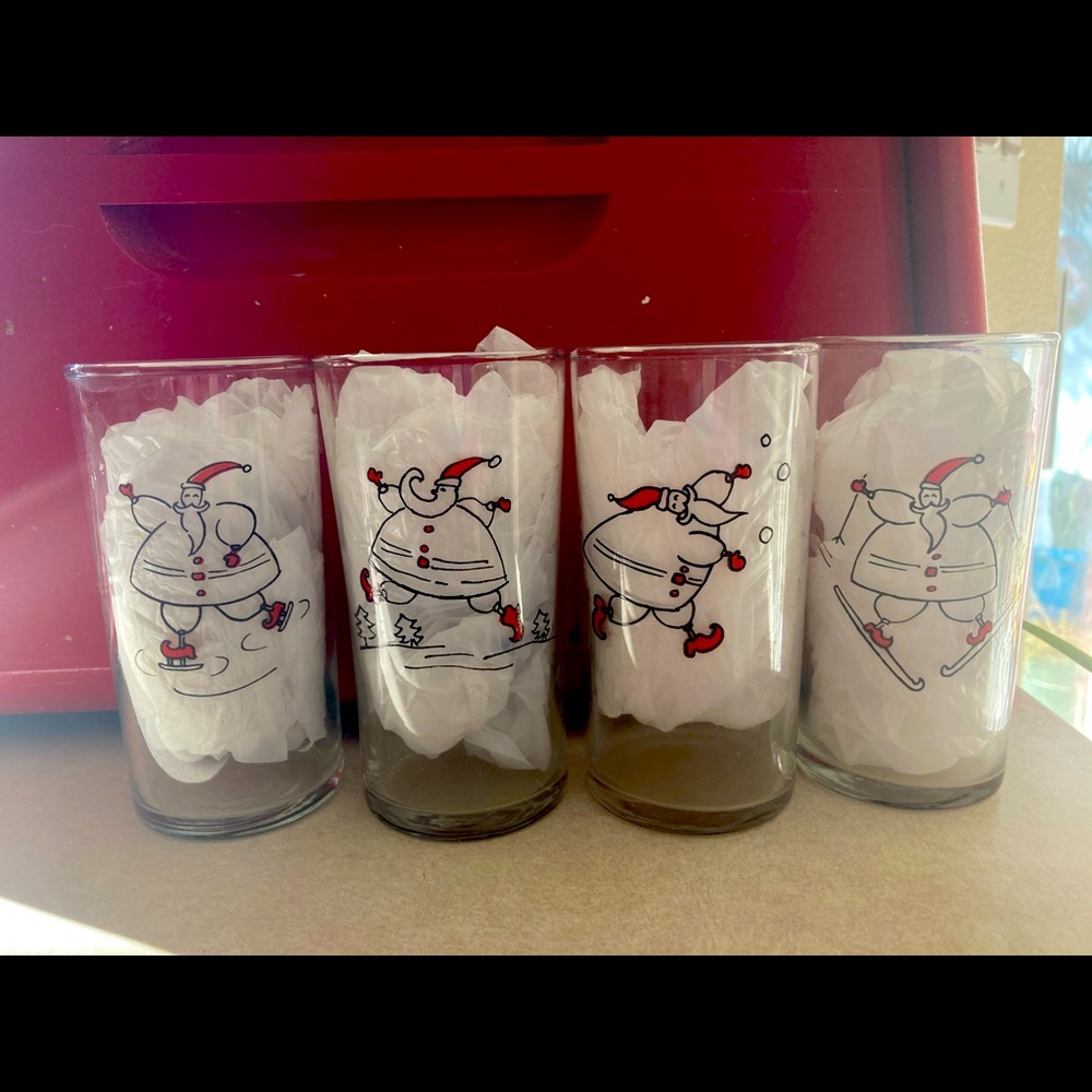 4  vintage Santa juice glasses, about 4 inches tall